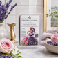 Chanelle & Savon 'Lavender Dreams' luxury candle wax melts in a clear clamshell package, styled on a marble surface with lavender, pink roses, and a soft blanket in the background.
